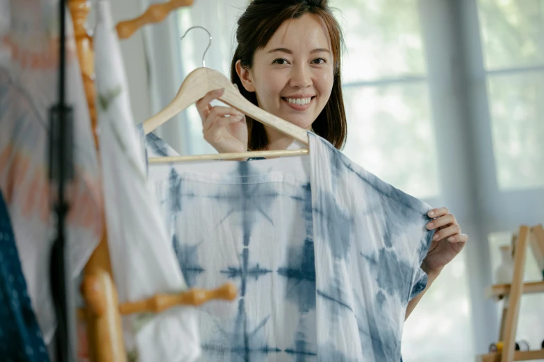 a lady looking at her clothes hanging out to dry