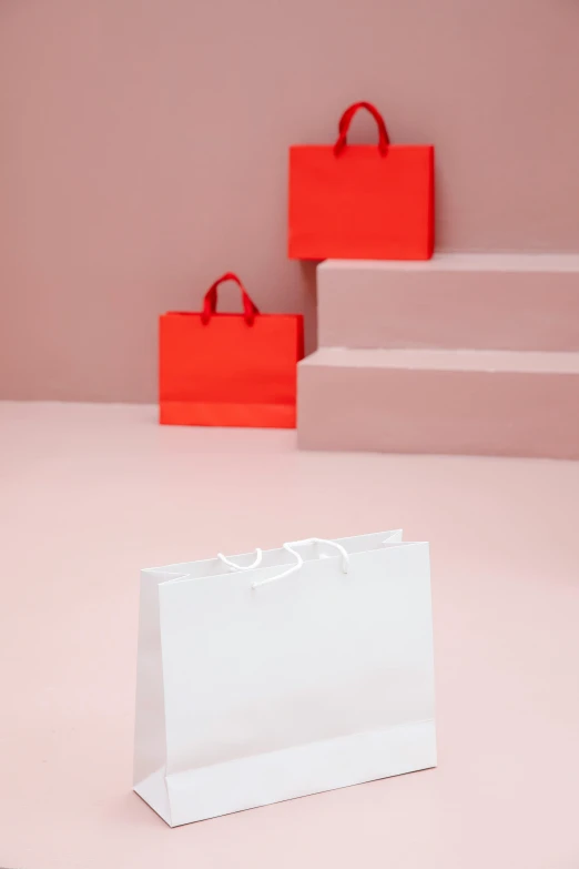 two red and one white paper bags