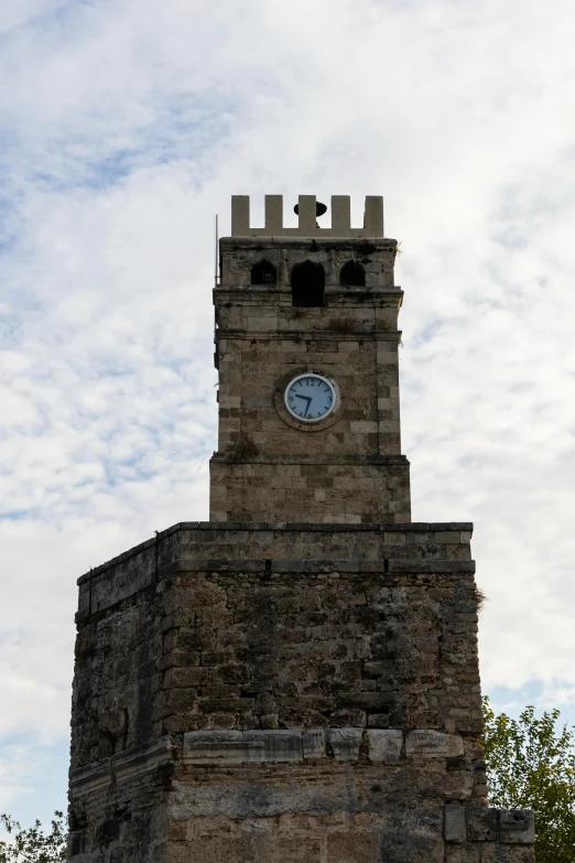 a tower clock tower on top of a castle building