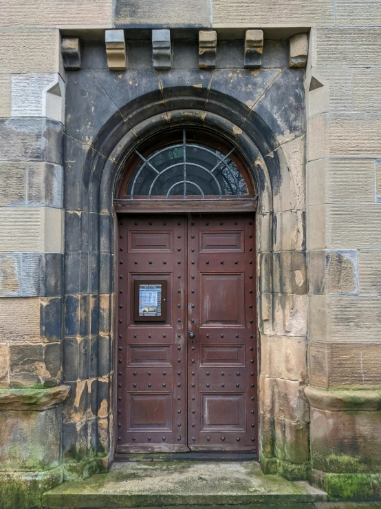 an old door is open with no glass in it