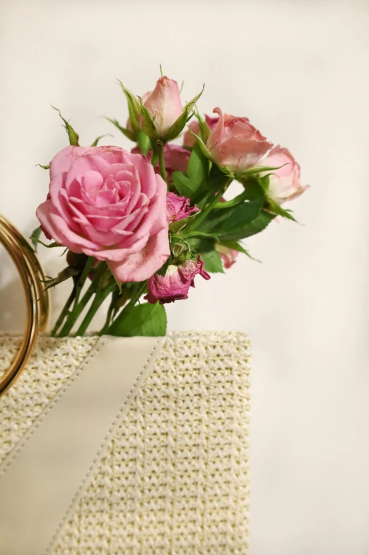 a close up of pink roses on a table