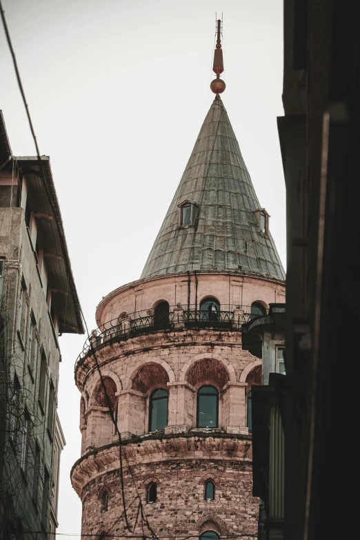 an old building in the city with a tower