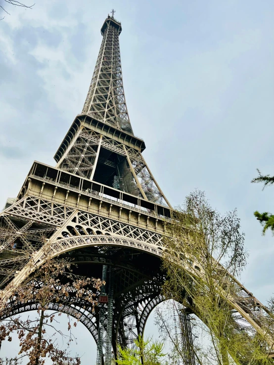 the eiffel tower is seen against a clear sky