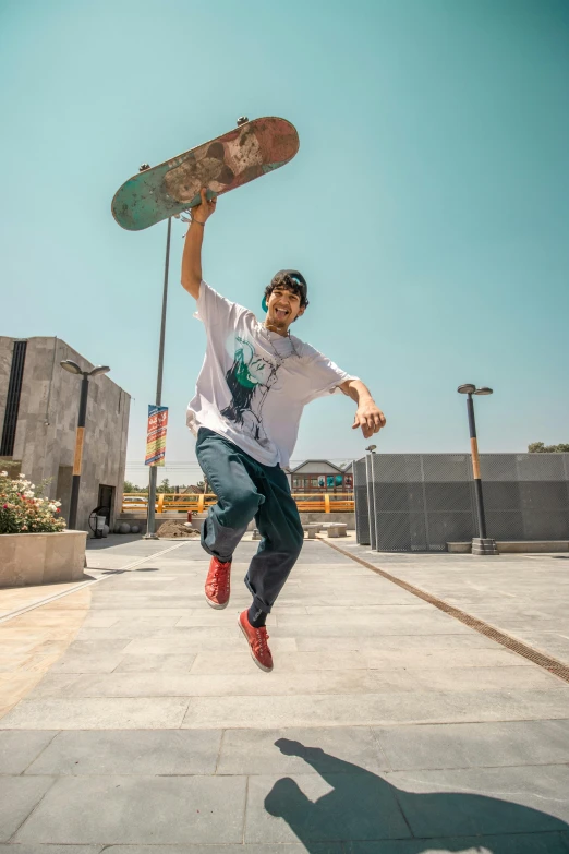 a person jumping up in the air with a skateboard