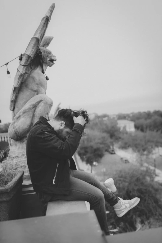 a man taking a po with a camera near an animal