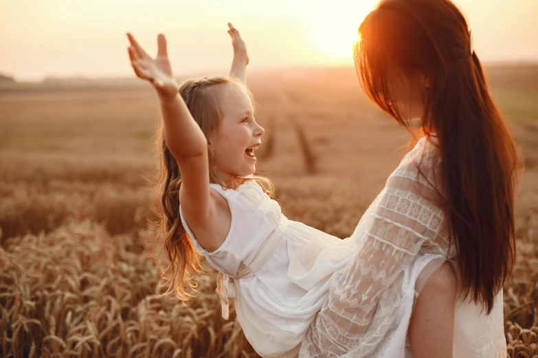 a couple of girls in a field