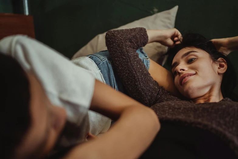 a close up of a person laying on a bed