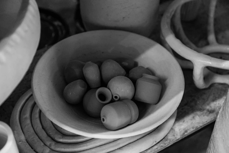 a close up of a bowl with some rocks in it