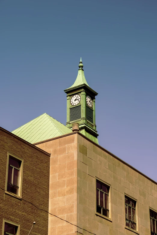 the top of an old brick building with a clock on it