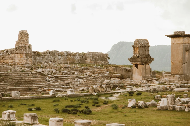 ancient ruins, one with a vase and another with stone columns