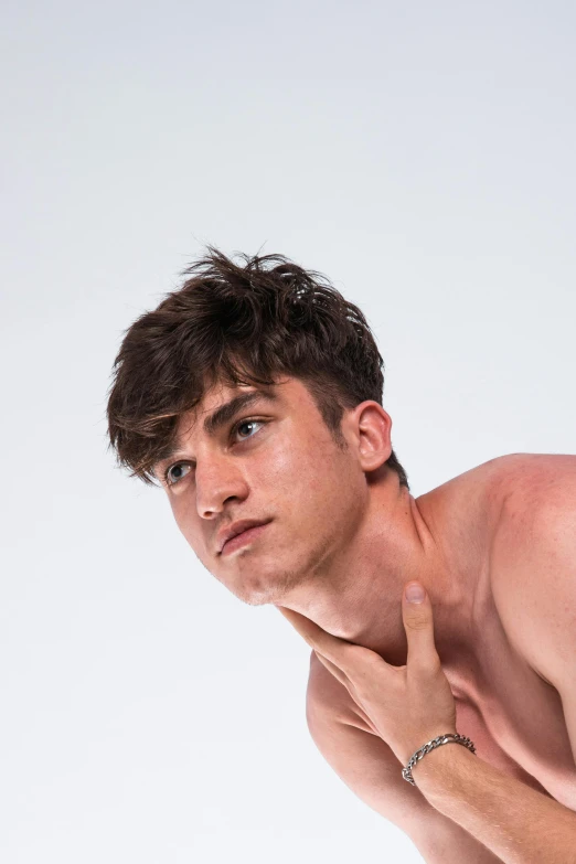 a male shirtless man in a white background