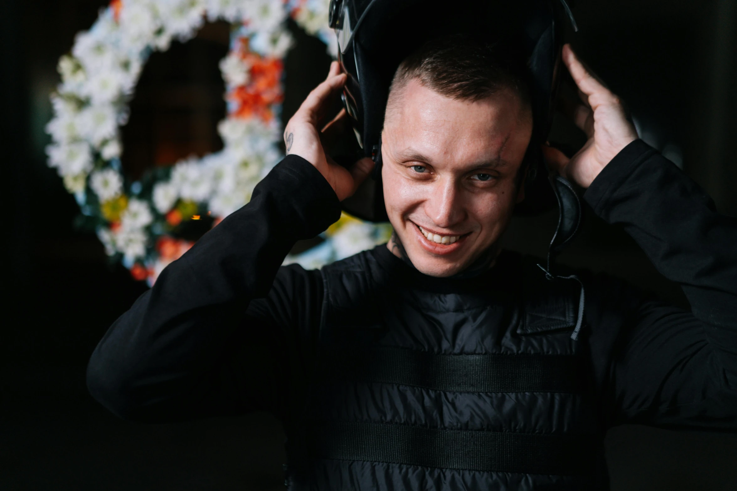 man listening to music in a dark room