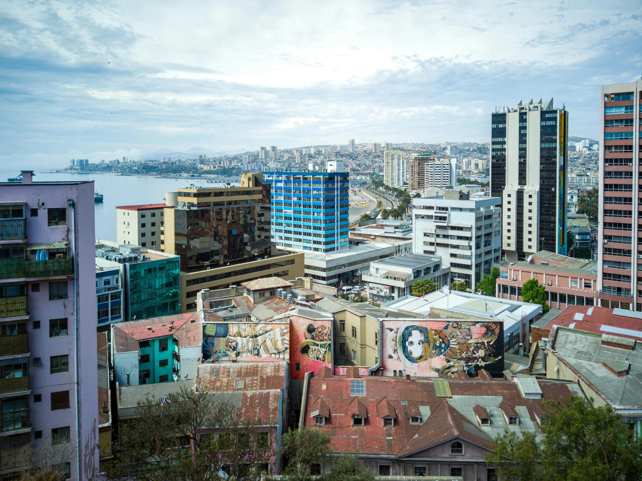 cityscape from above with a very large body of water