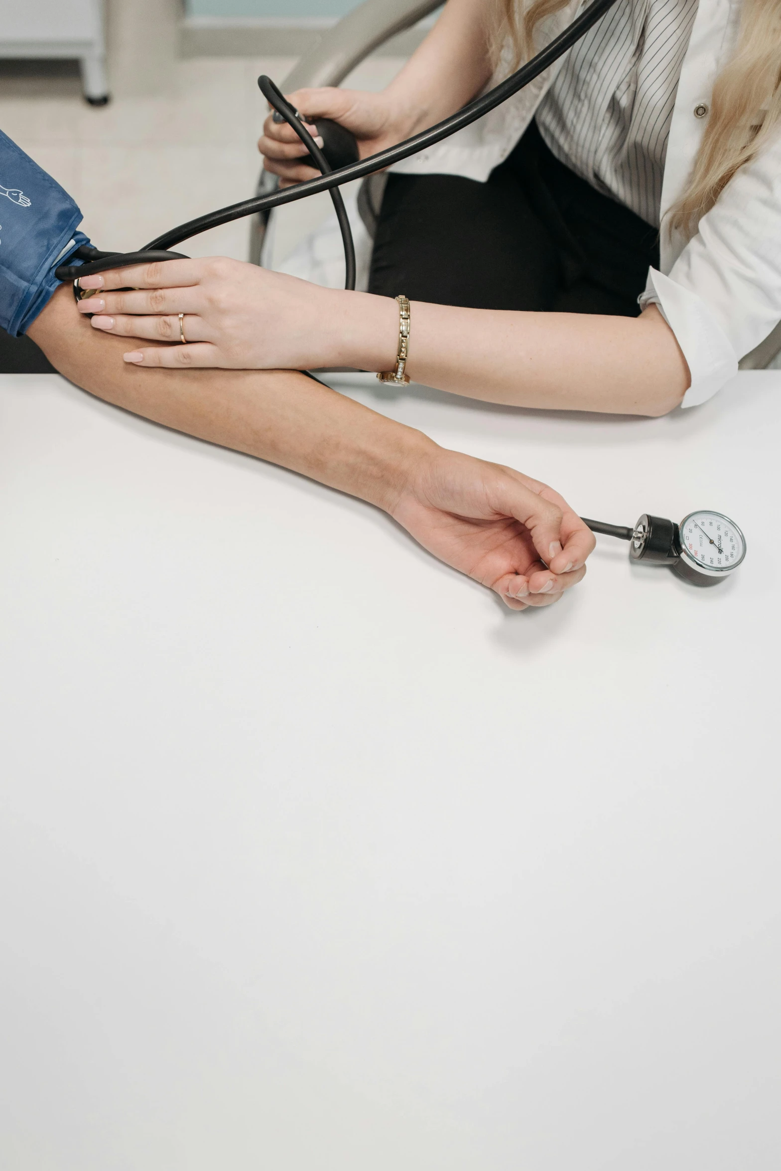 a female hand is hooked up to a  pressure needle