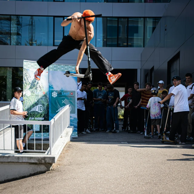 man in black and orange clothing doing skateboard tricks