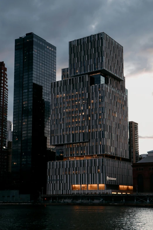 this modern building is at the edge of a body of water