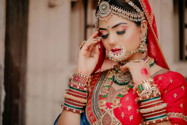 indian bride wearing jewellery and makeup, bridal outfit