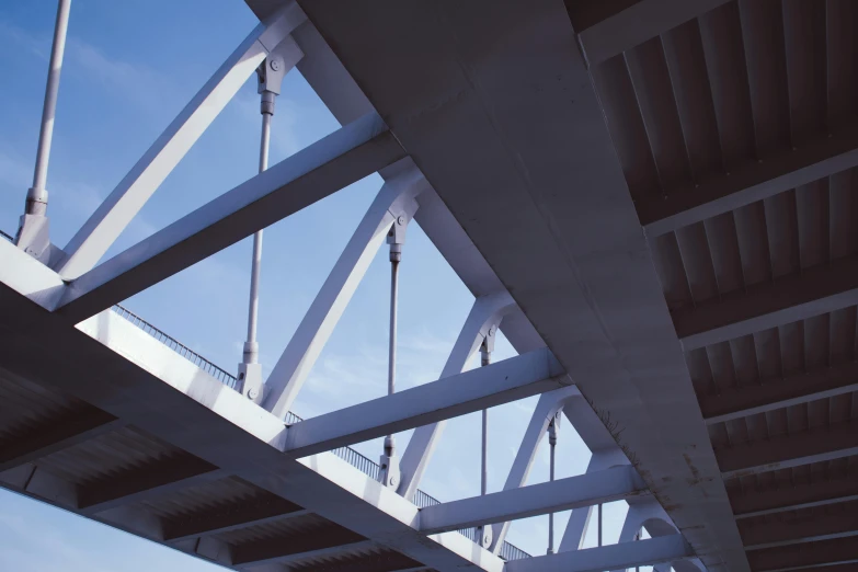 a large steel structure is shown against the blue sky