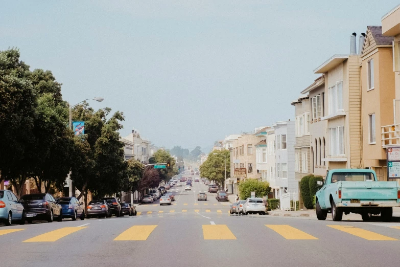 cars are parked on both sides of the street