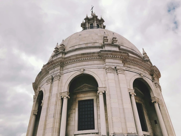 a tall, white dome sitting on the side of a building