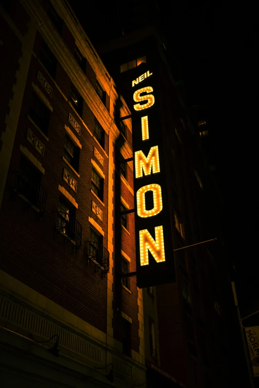 a large neon sign for a restaurant at night time