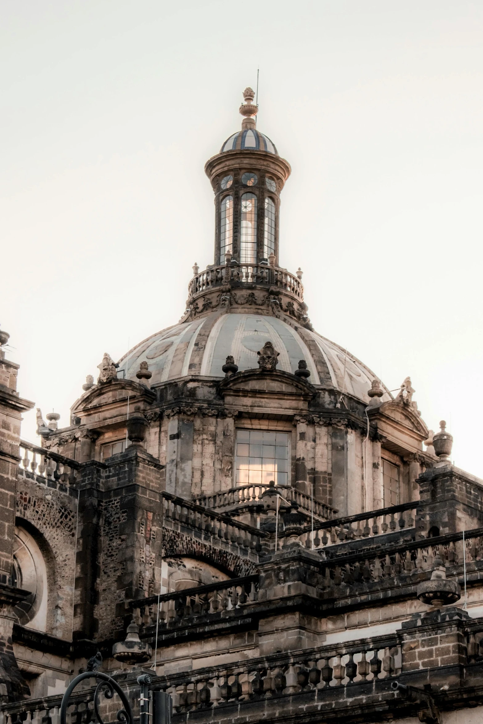 large ornate stone building with clock on top