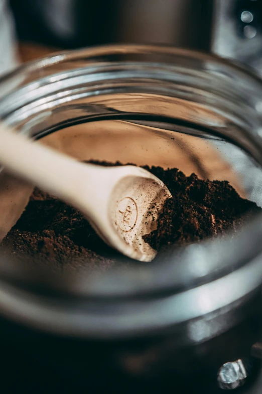 a spoon is stirring chocolate into some sort of cookie batter