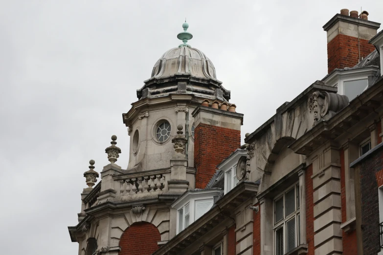 an old building has three clocks on it