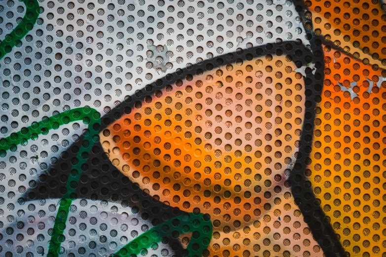 artwork with orange and green circles covering the image