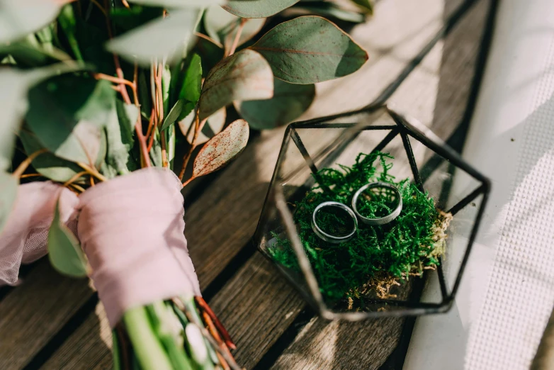 a picture of a wedding ring and flowers