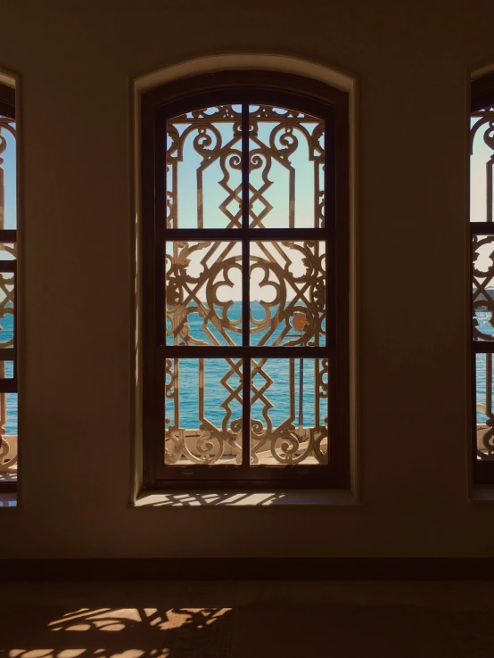 three windows are shown, with the water outside of them