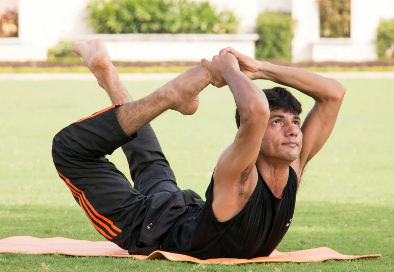 a man does a stretch out on the grass