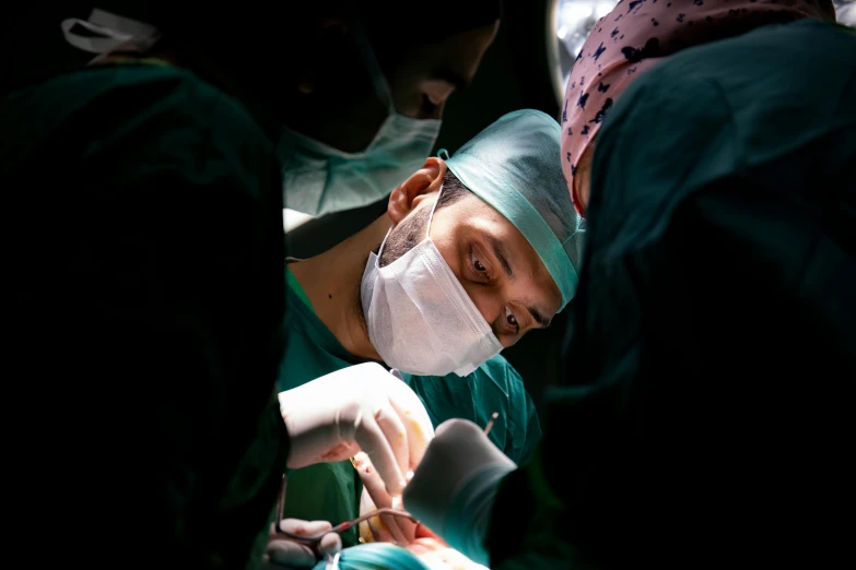 the surgeon uses an iv to treat an injured patient