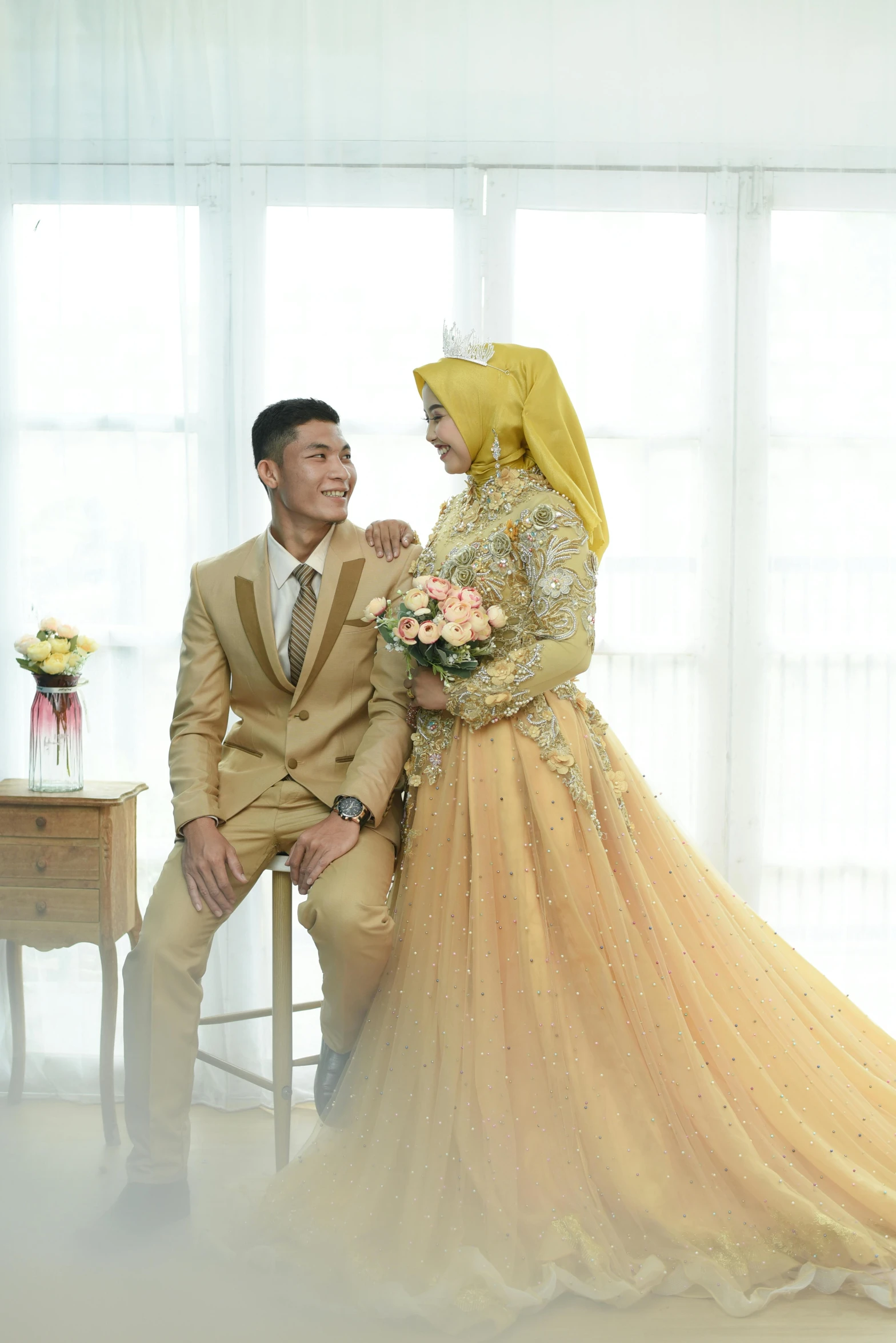 an image of a bride and groom wearing hijab