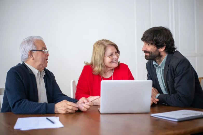 people at a conference having conversation while smiling