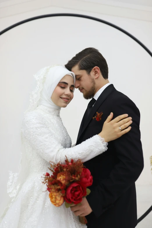 the couple is posing for a wedding po