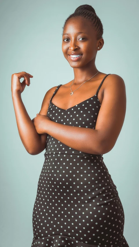 a woman in a dress posing for a picture