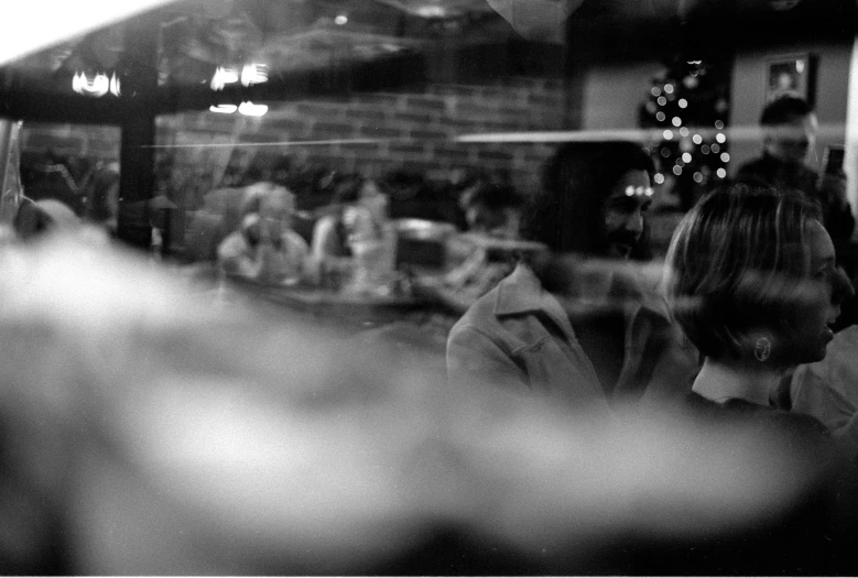 this black and white po shows people sitting at tables