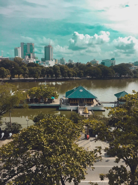 a park near a lake and several buildings