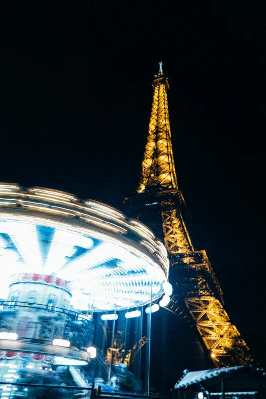 the eiffel tower is shown at night