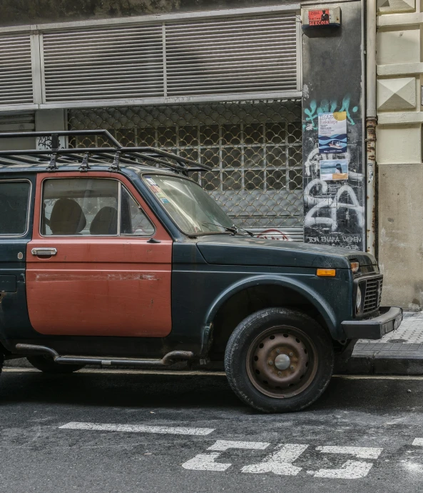 an old pickup truck parked on the street