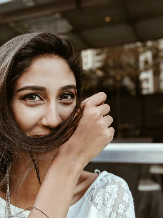 a beautiful young woman with long hair smiling