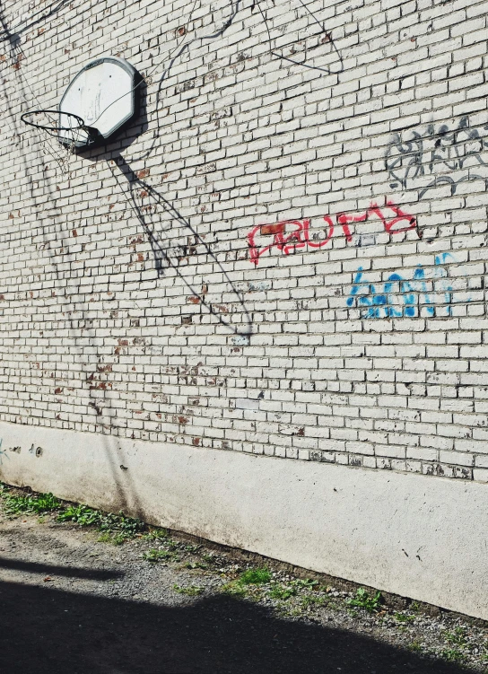 a wall with some graffiti on it