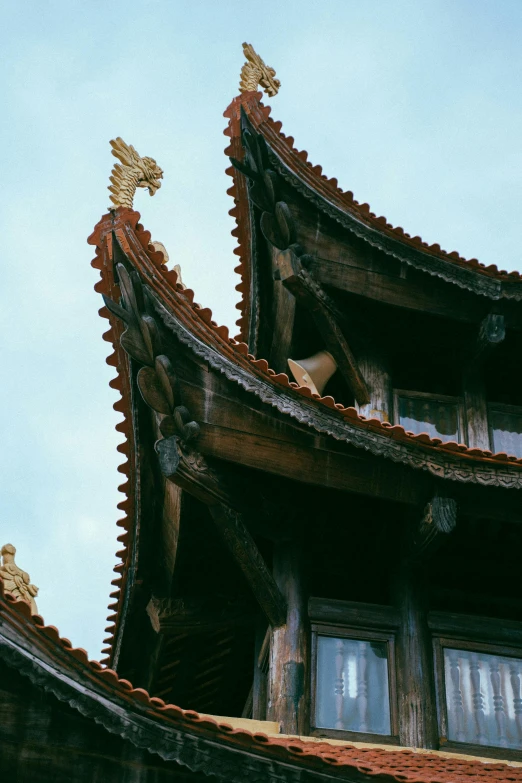 the roof of a building with gold roof tops