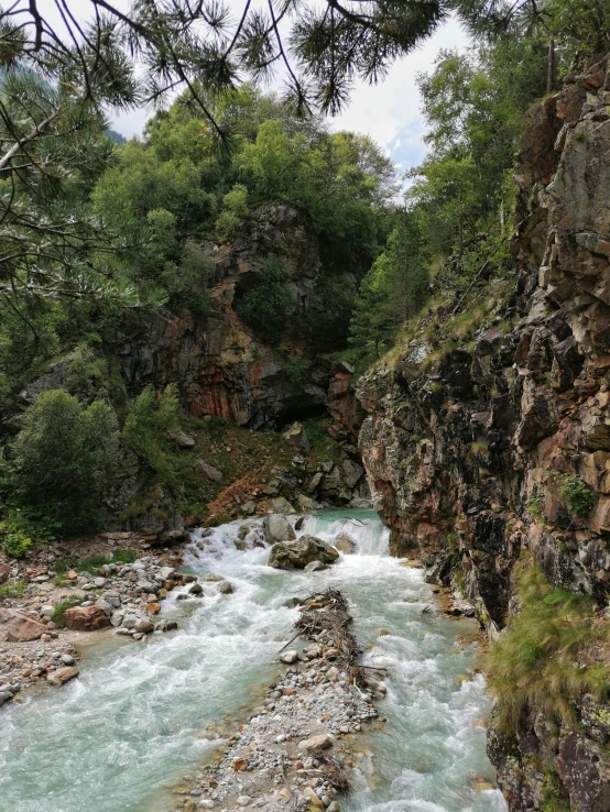 a river with rocks and water running between it