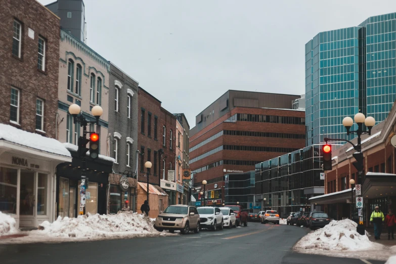 a street with traffic lights and cars in the background