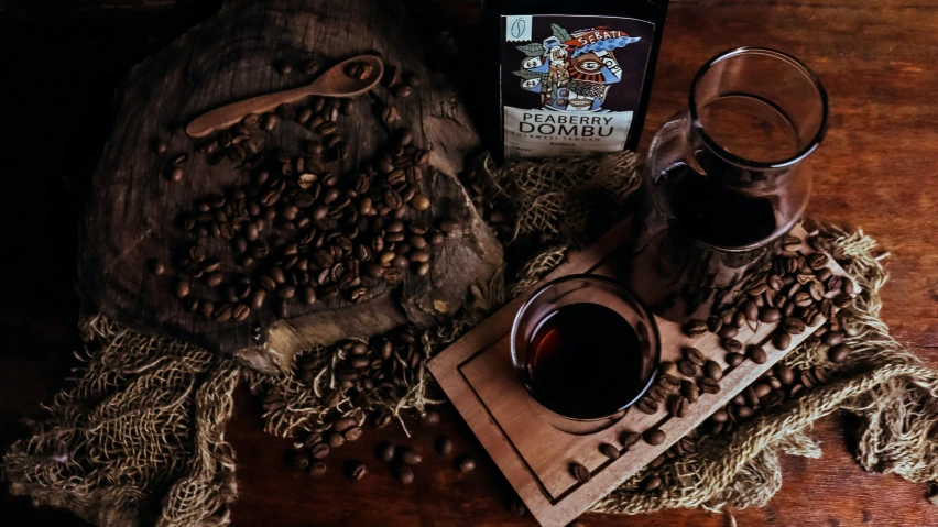 a wooden table with a cup and two cups and a teabag