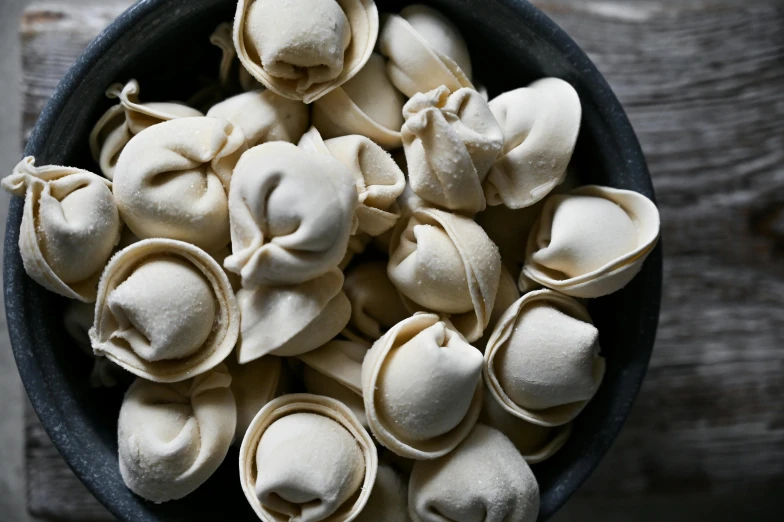 pasta shells piled up in a black bowl