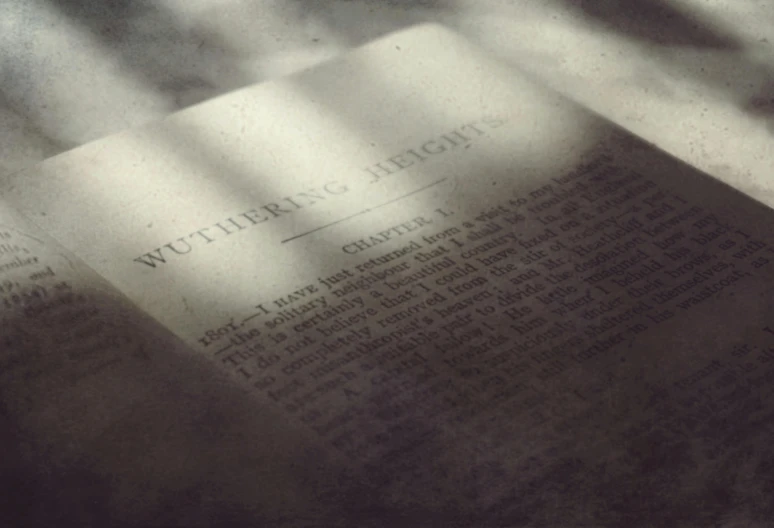 the shadow of a book and table