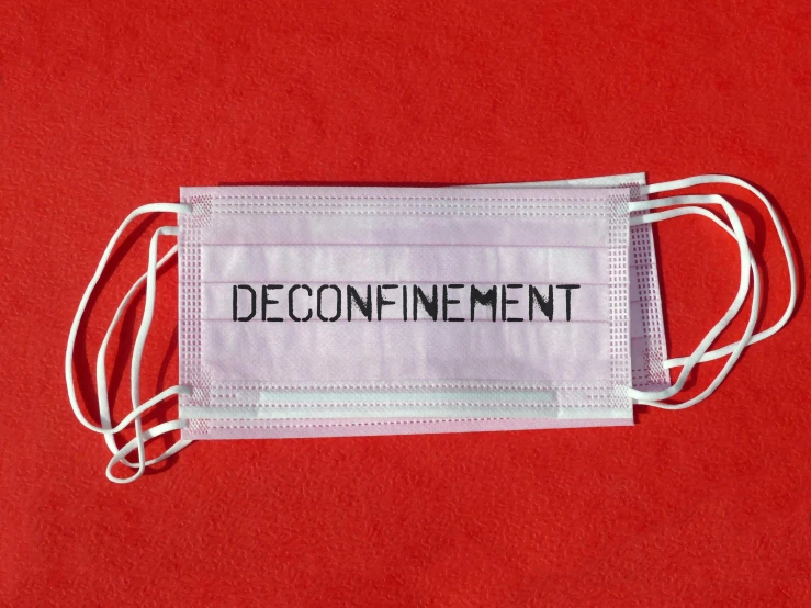 a face mask with the word'deconfiatment'printed on it